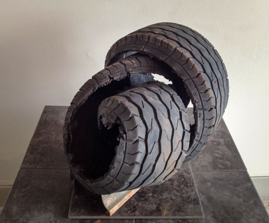 Twist top view, altered tire piece and metal, 14"H x 20"W x 12"D